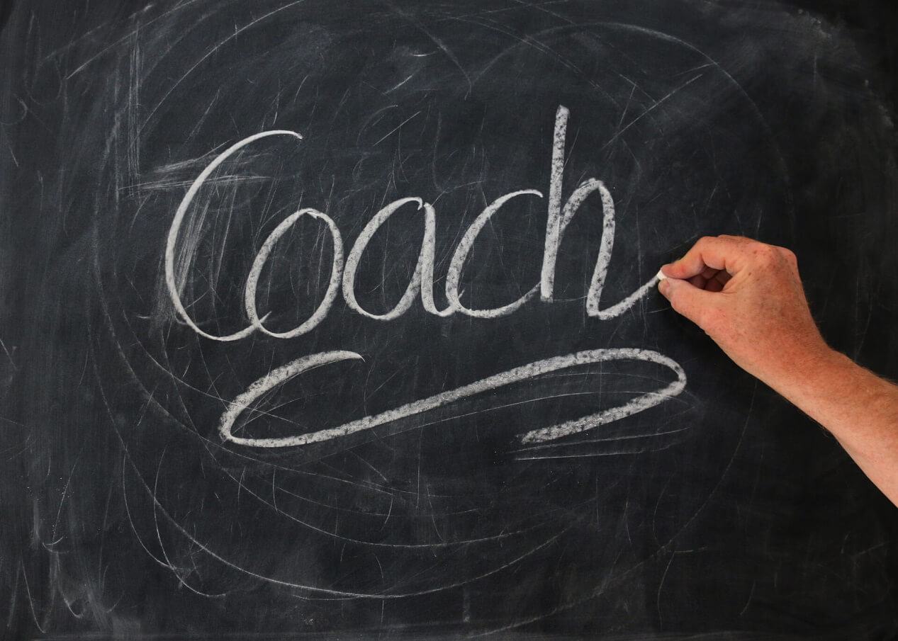 Coach, written on a chalkboard