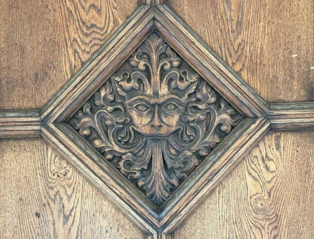 Mystical face engraved on door